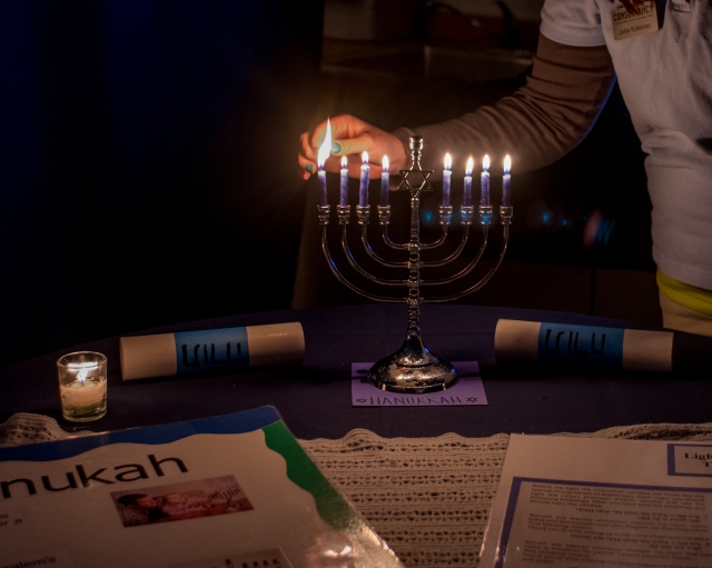 Lighting the Hanukkah menorah.  Credit: Tim Fenner