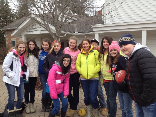 Colleen (in the bright yellow jacket) with some of her 7th grade students.